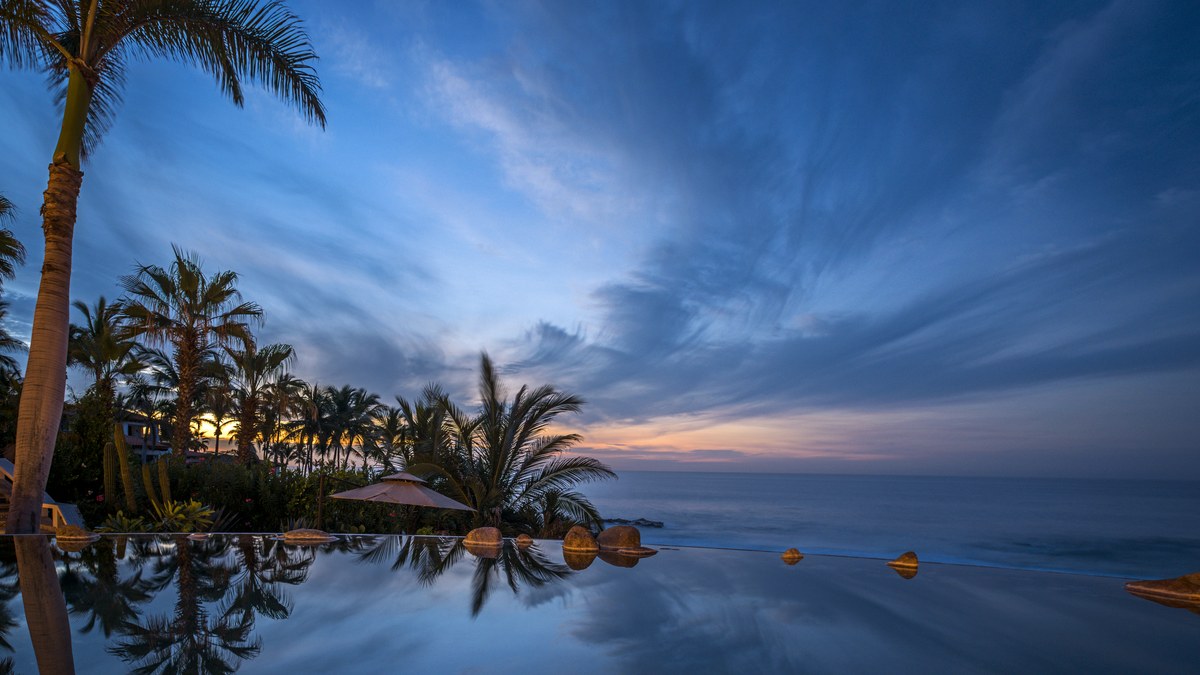 Sunset reflected over an infinity pool in Palmilla, Los Cabos.
